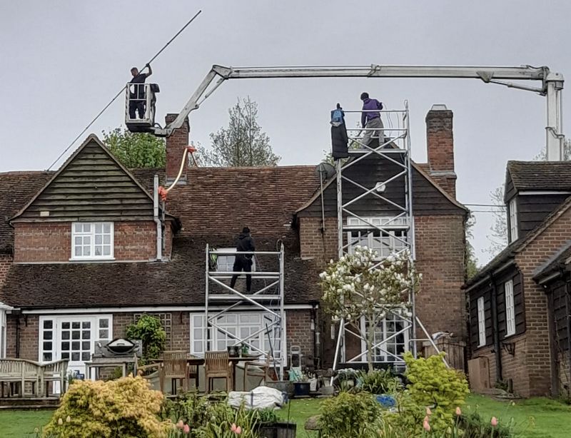 The Moss Cleaners using cherry picker and scaffolding to clean roof safely and professionally in Staple Hill, Gloucestershire